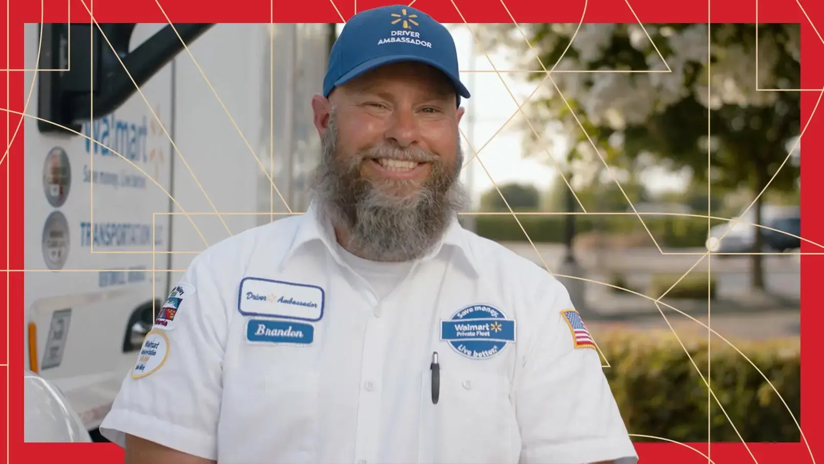 Truck Driver Brandon Hirst smiles near the back of his truck. The photo has a red border and thin, gold, and geometric lines running through the background.